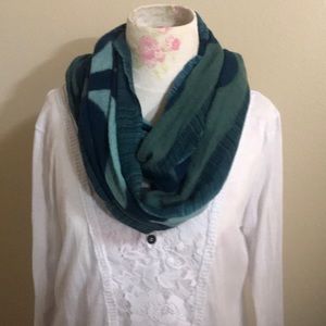 White embroidered blouse and green Italian scarf.